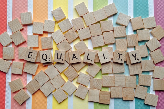 The word equality written in Scrabble tiles