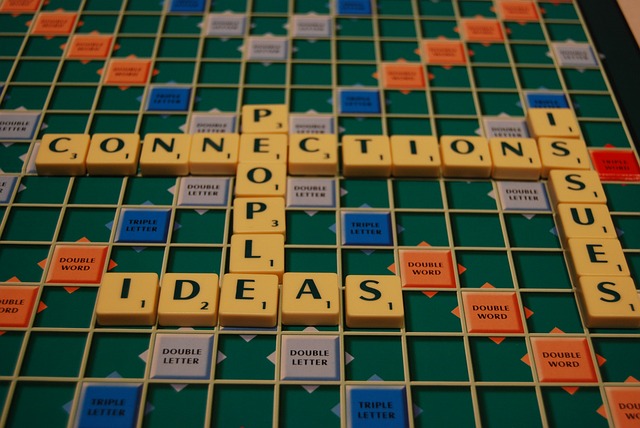 A scrabble board with social words such as people and connection